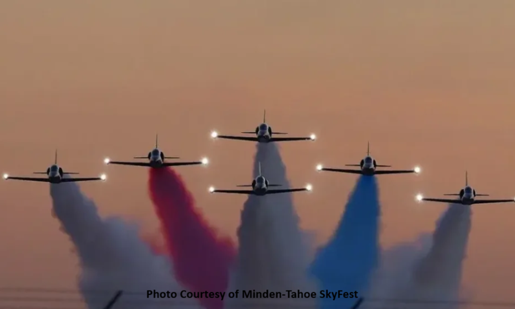 Photo image of six military jets flying in show formation trailing red, white and blue smoke. Says image courtesy of Minden-Tahoe SkyFest. Support Austin’s House at Minden-Tahoe SkyFest